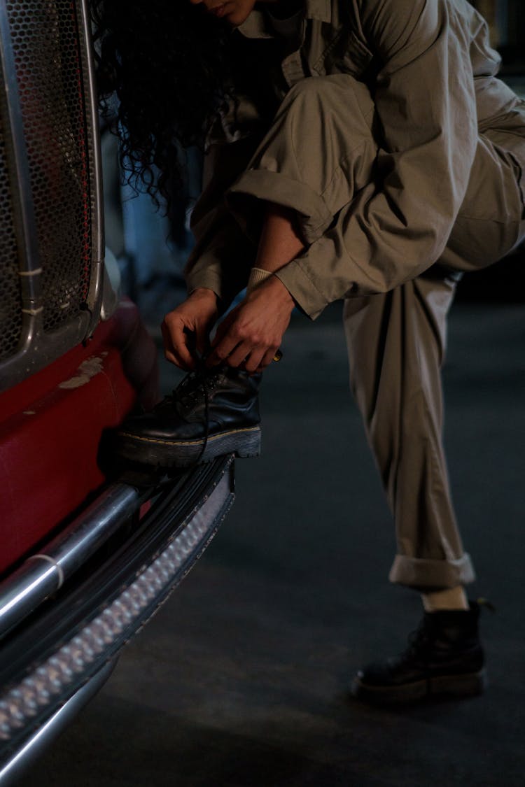 A Woman Tie Her Shoe