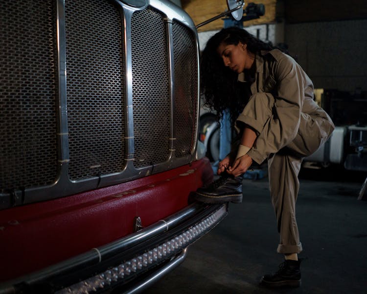 A Woman Tie Her Shoe 