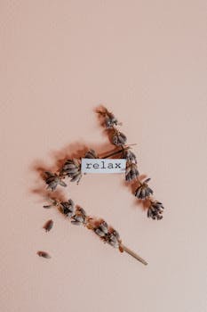 Simple and soothing dried flowers arrangement with 'relax' text on a beige background.