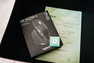 Box with photo of game mouse near certificate