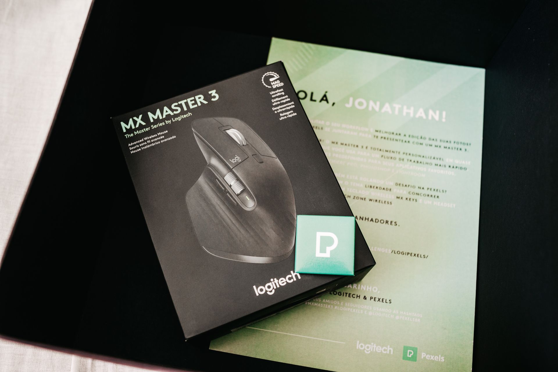 Box with photo of game mouse near certificate