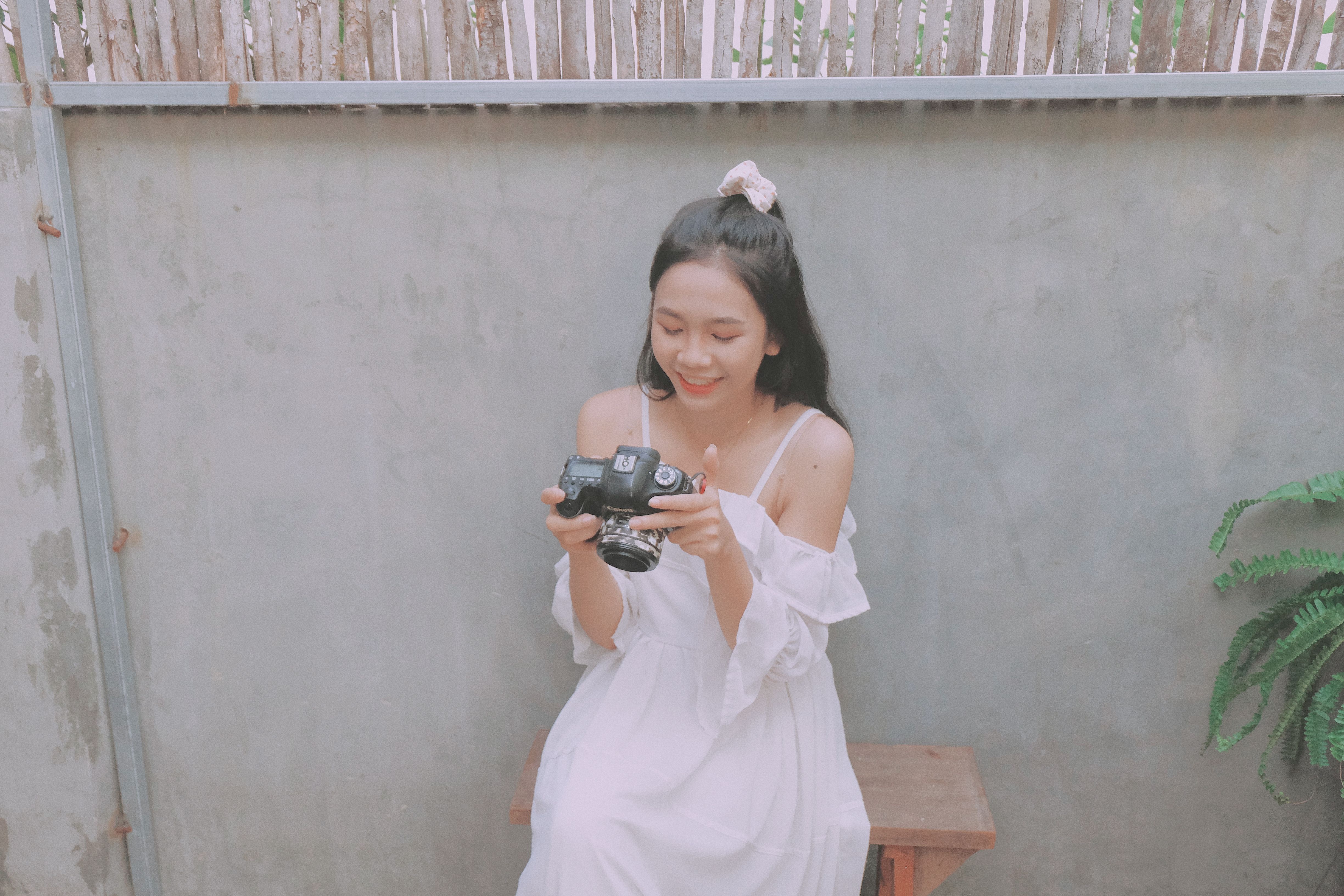 A person smiling and looking relaxed while enjoying a hobby