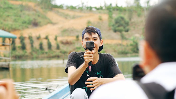 A Man Holding Gopro Camera