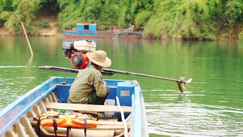 A Man Sitting on the Boat