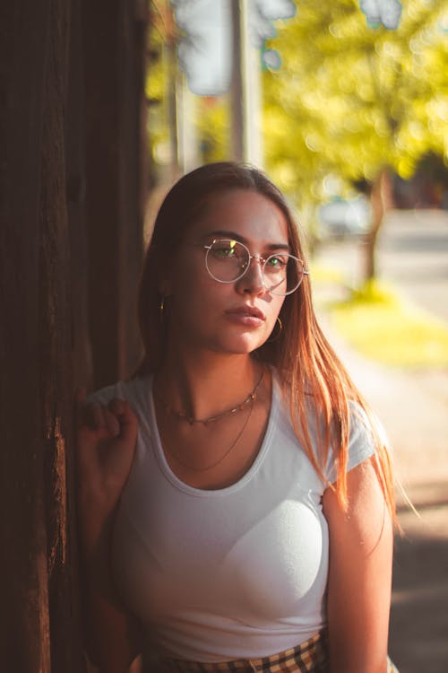 A Woman in White Shirt Wearing an Eyeglasses