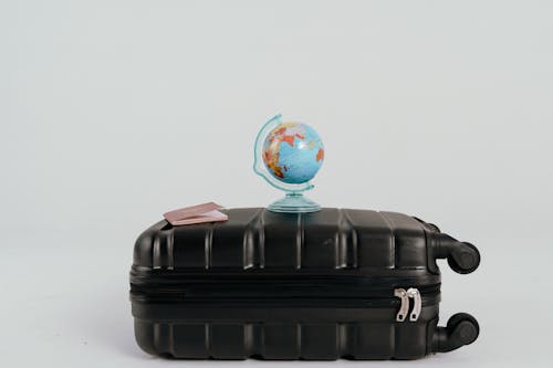 A Desk Globe on a Black Luggage
