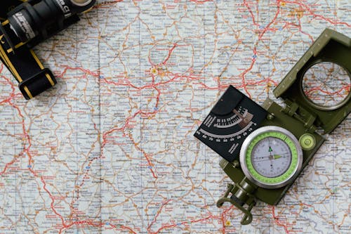 Free A Compass on a Map Stock Photo