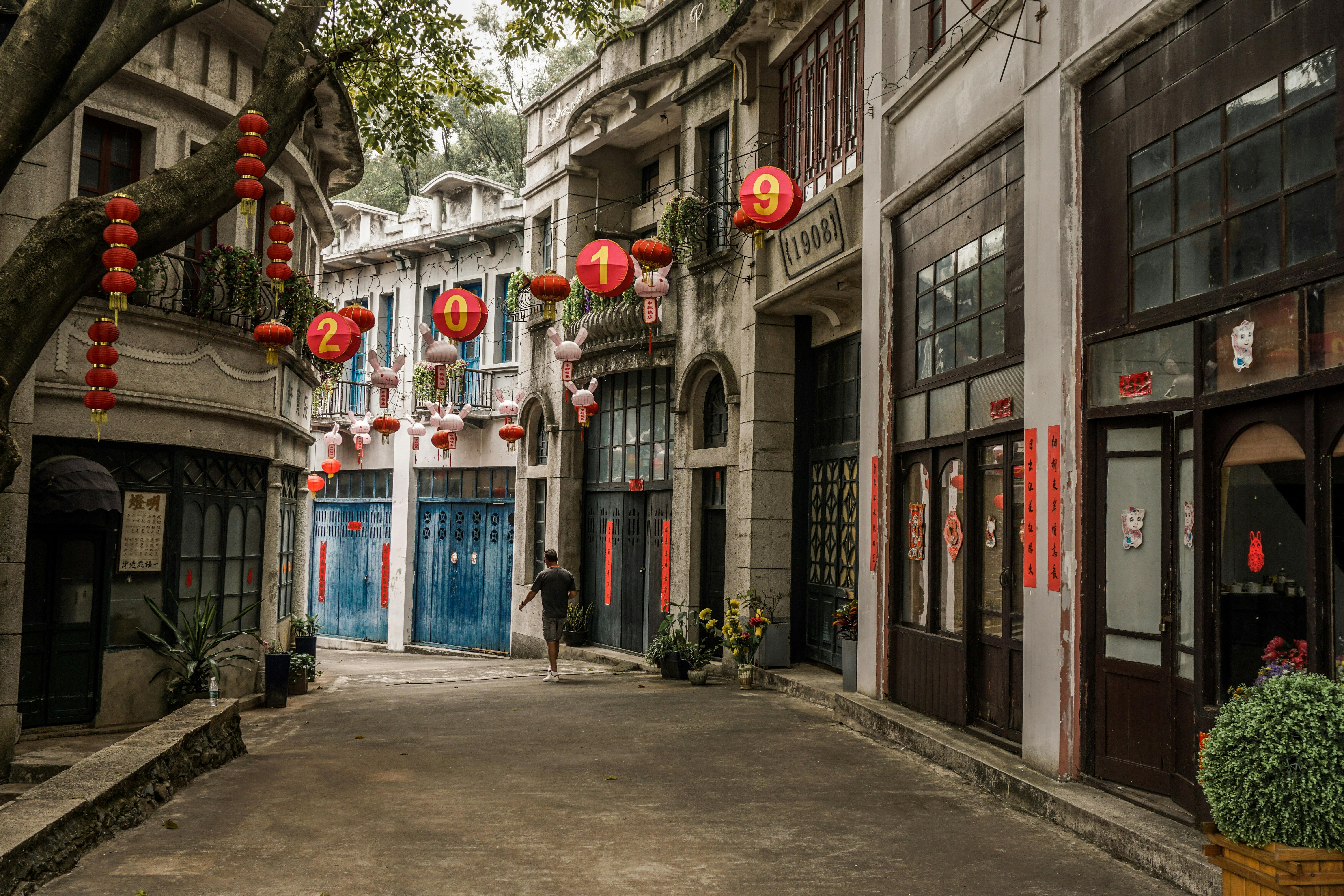 man walking in an alley