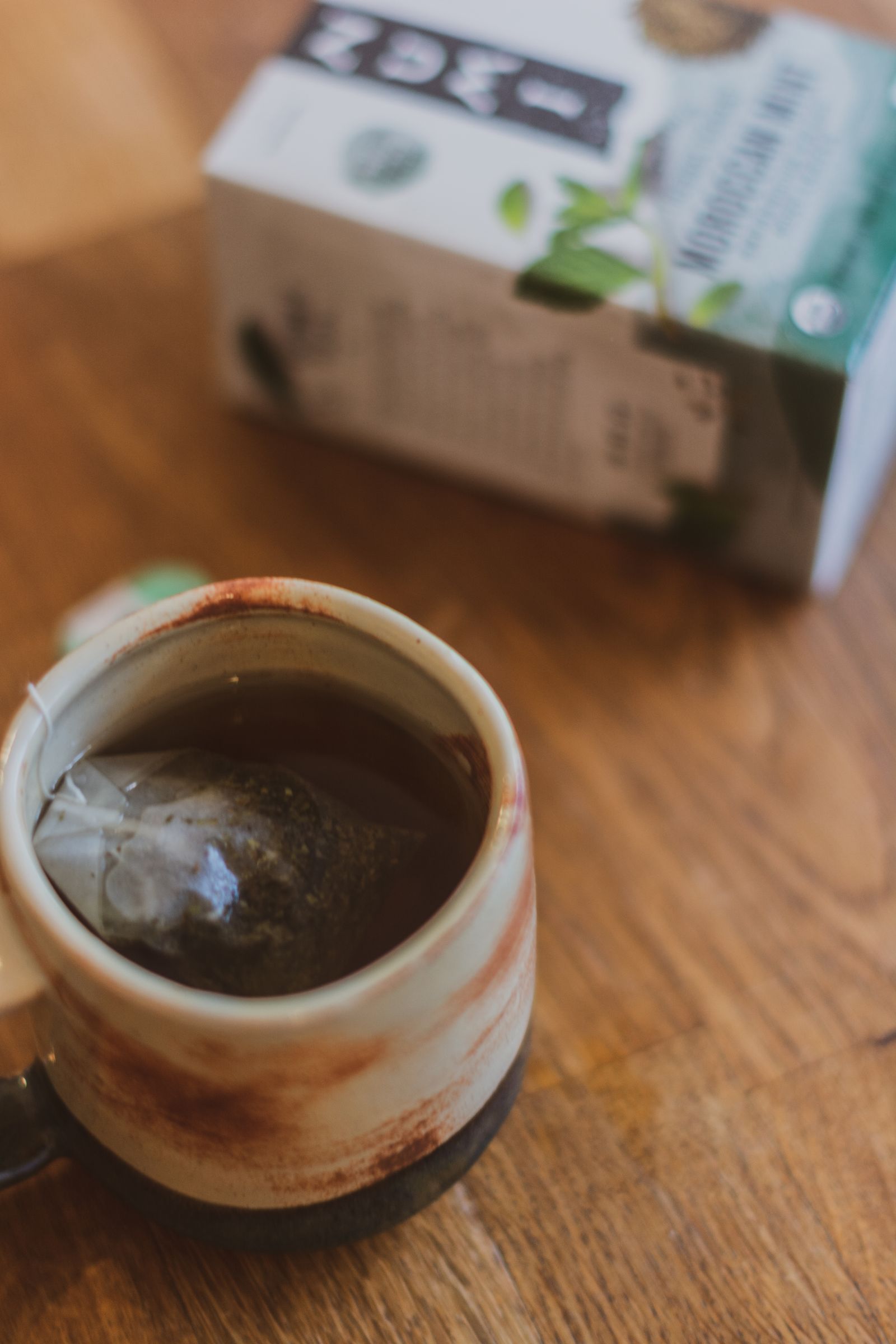 A ceramic cup on a wooden table