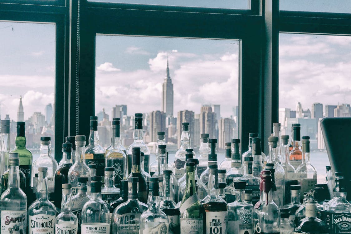 Assorted Bottles Near Windows