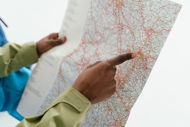 A Person Holding A Map 