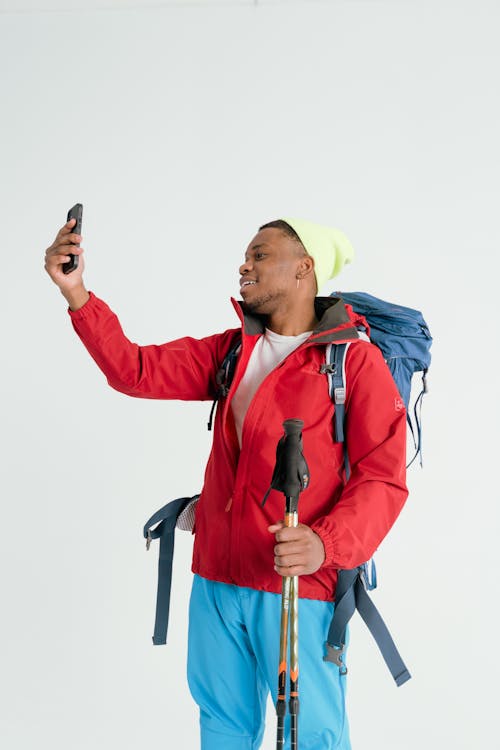 Hiker looking at a Smartphone 
