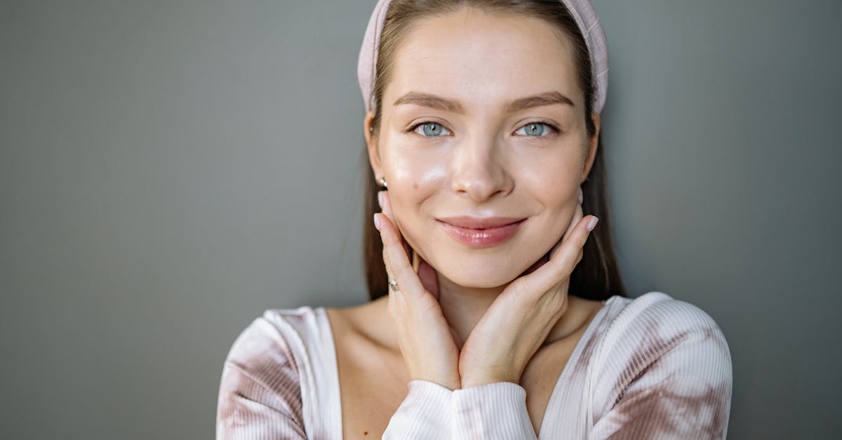 A man jogging in the park at sunrise.