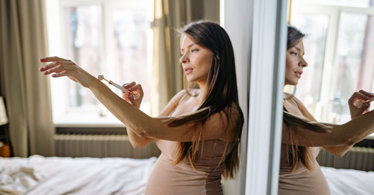 A pregnant woman receiving a gentle massage in a soothing spa setting.