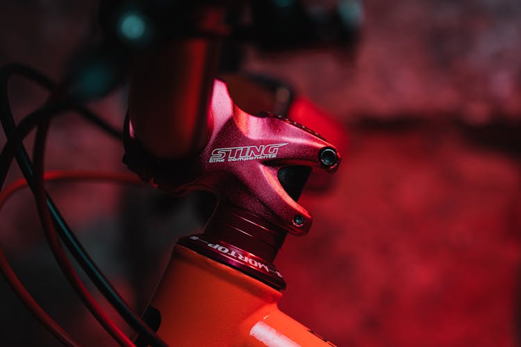 A Red Bike Accessory With Sting Brand