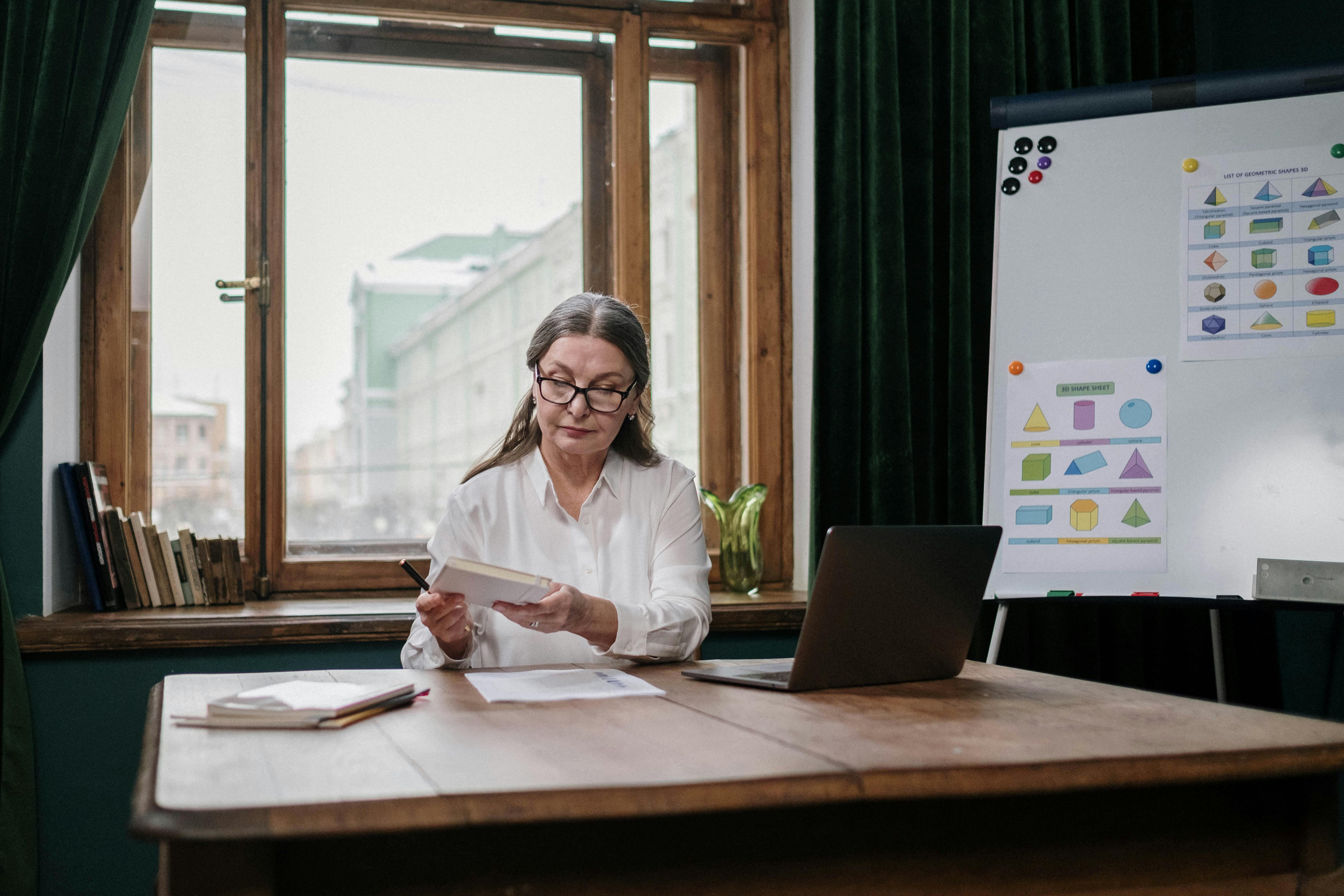 A Happy Elderly Couple Holding a Document · Free Stock Photo