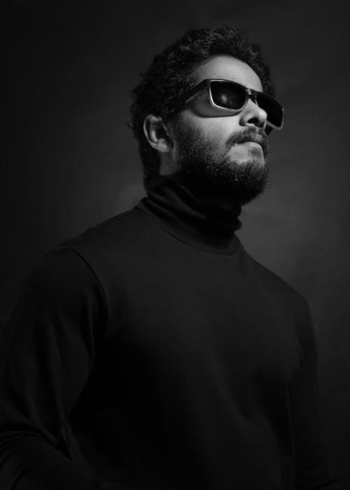 Grayscale Photo of a Man in a Turtleneck Shirt