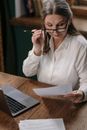 Woman in White Dress Shirt Holding White Paper