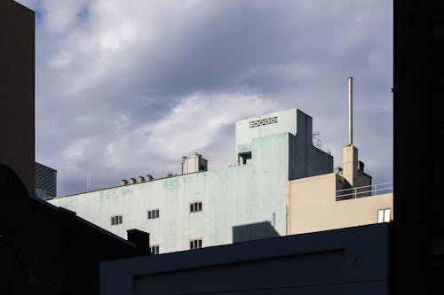 Free Low angle Shot of an Industrial Building Stock Photo