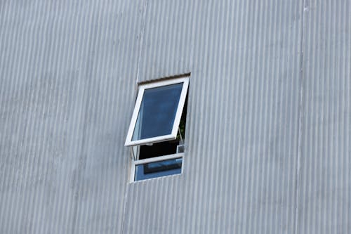 Photograph of a Building with an Open Window