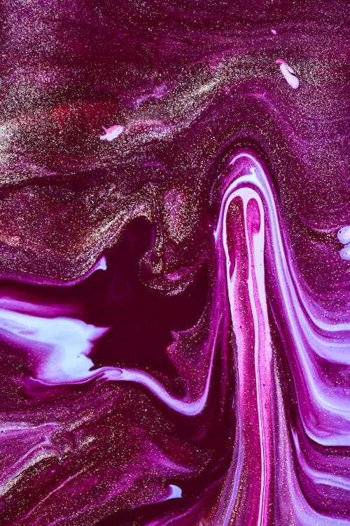 Free Glossy surface of purple liquid nail polish Stock Photo