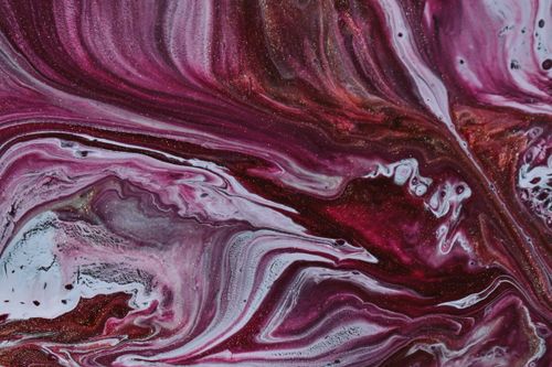 Free From above abstract background of white and purple paints blending chaotically on surface and creating swirls Stock Photo
