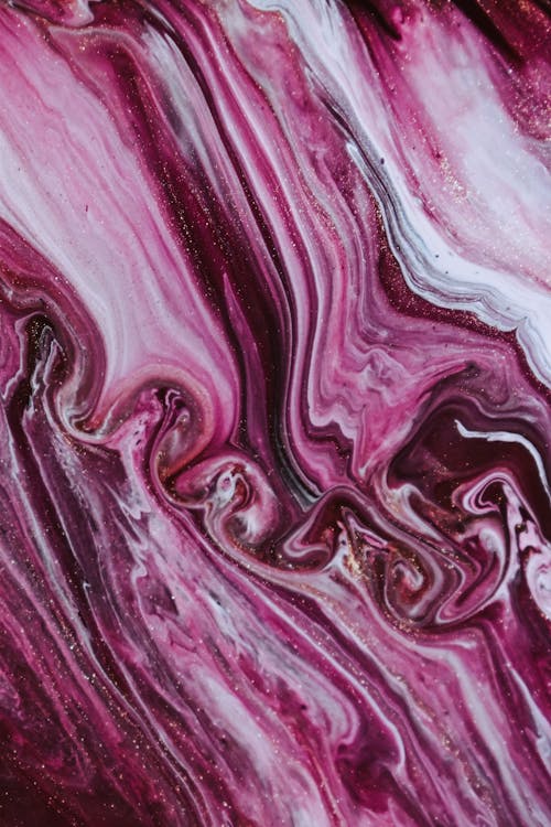 Chaotic pattern of shiny mixed purple and white dyes