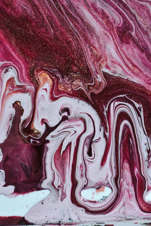Free From above of bright liquid purple and white paints spilled on surface creative abstract gradient pattern Stock Photo