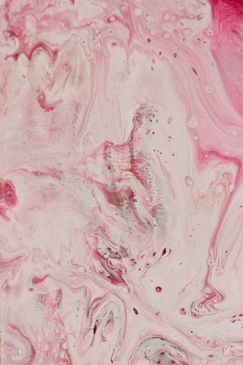 Free From above of gradient white and pink liquid dyes splattered on surface as background Stock Photo