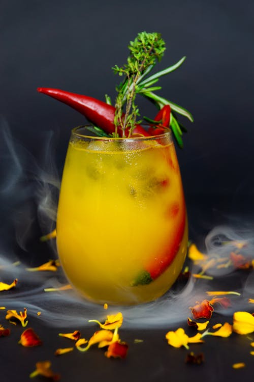 Free Photo of a Drink with Red Chili Peppers Stock Photo