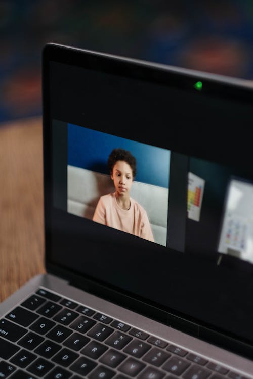 Free Photograph of a Kid on a Laptop's Screen Stock Photo