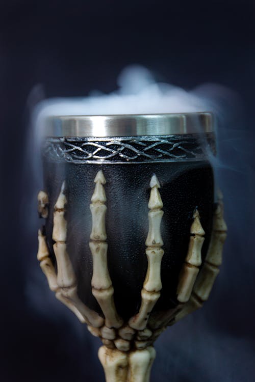 Close-Up Photo of a Black Cup with Smoke
