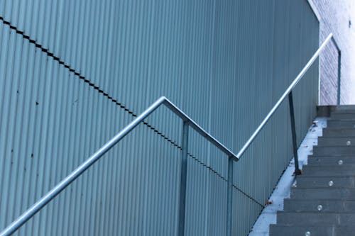Photograph of a Staircase with a Metal Handrail