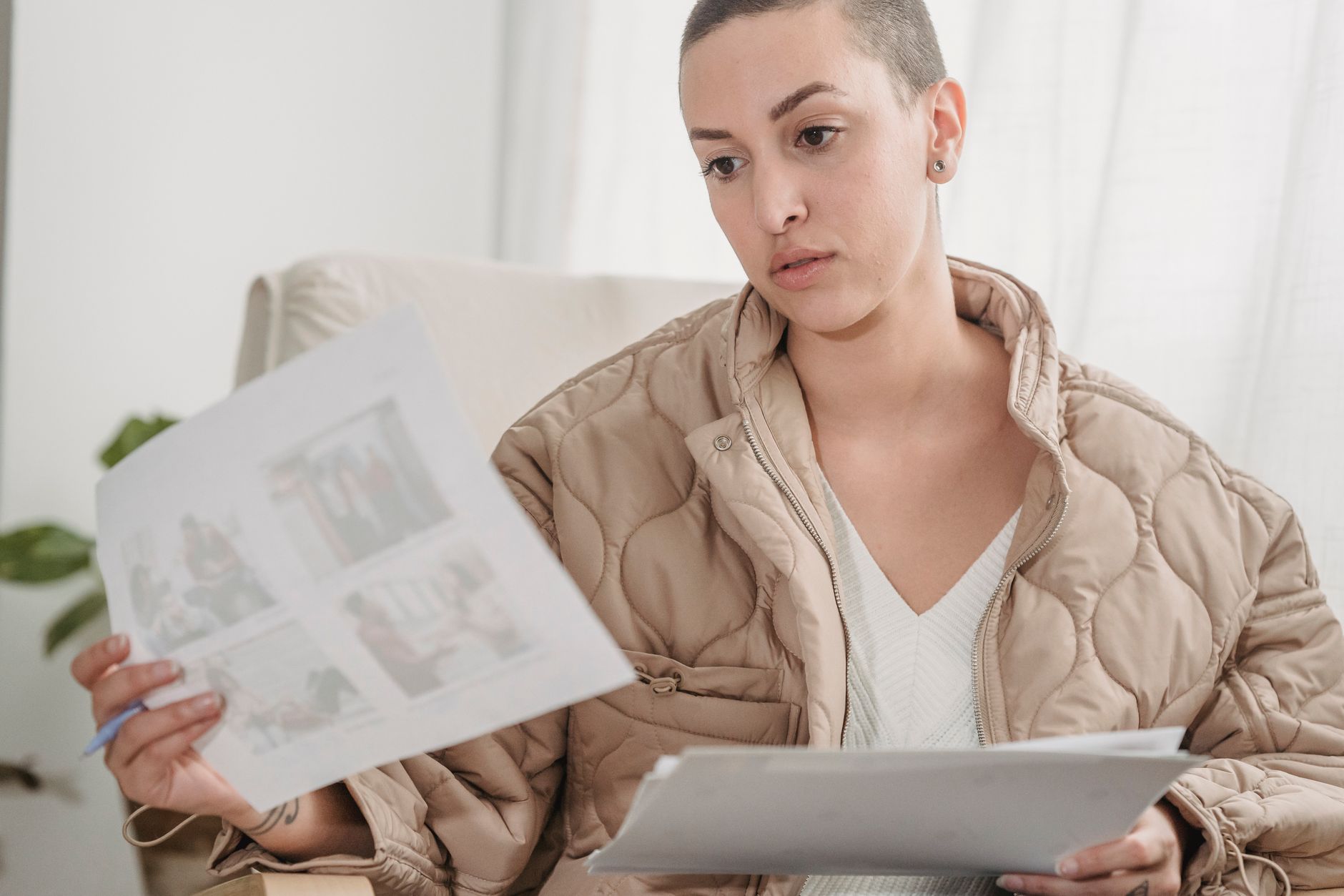 A calm person reviewing a self-exclusion form and monthly budget beside a closed betting account