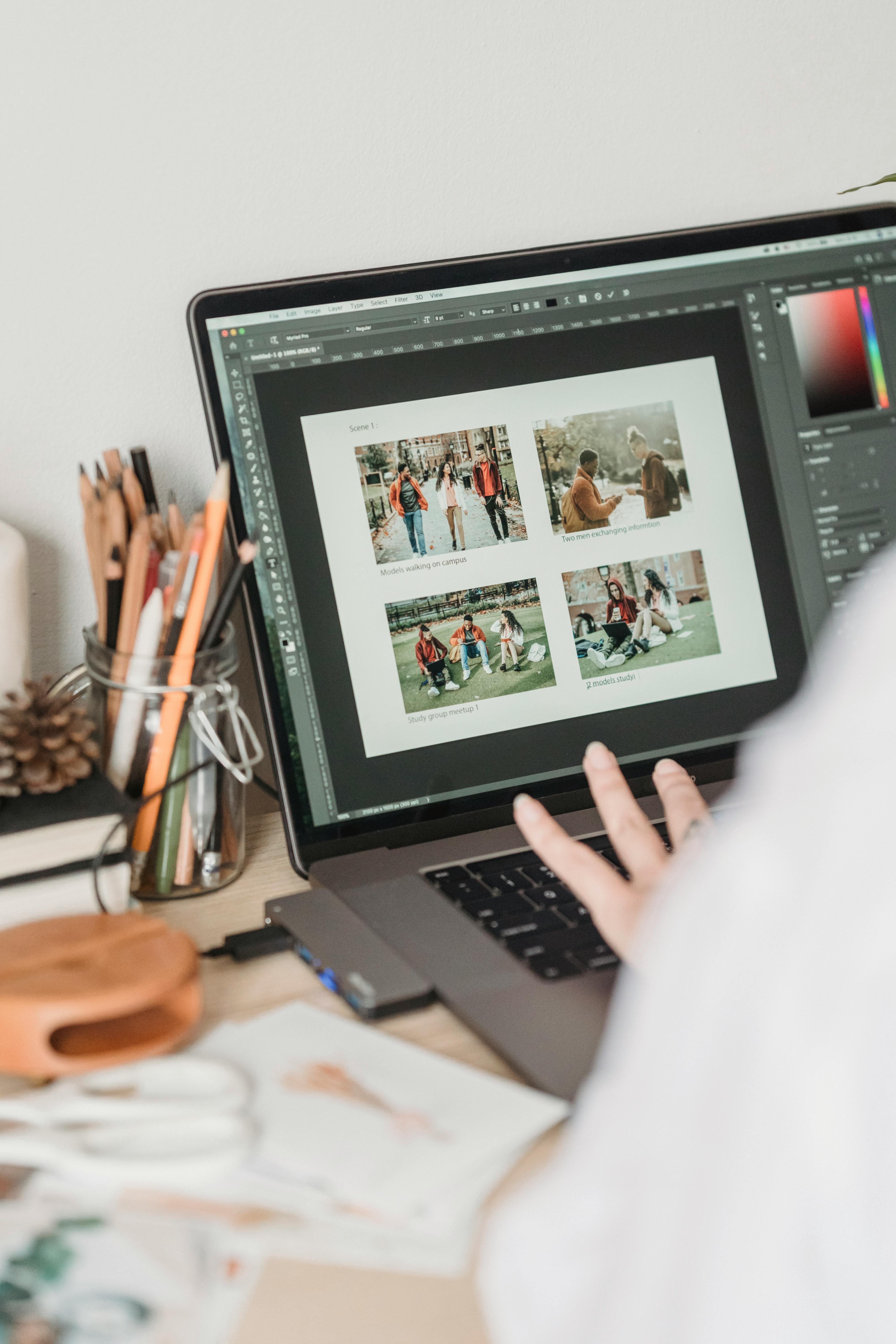 anonymous woman retouching photos using netbook