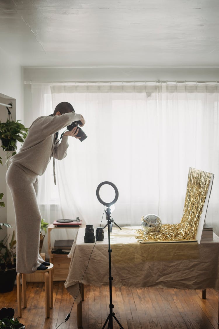 Photographer Taking Pictures Of Tinsel And Party Ball