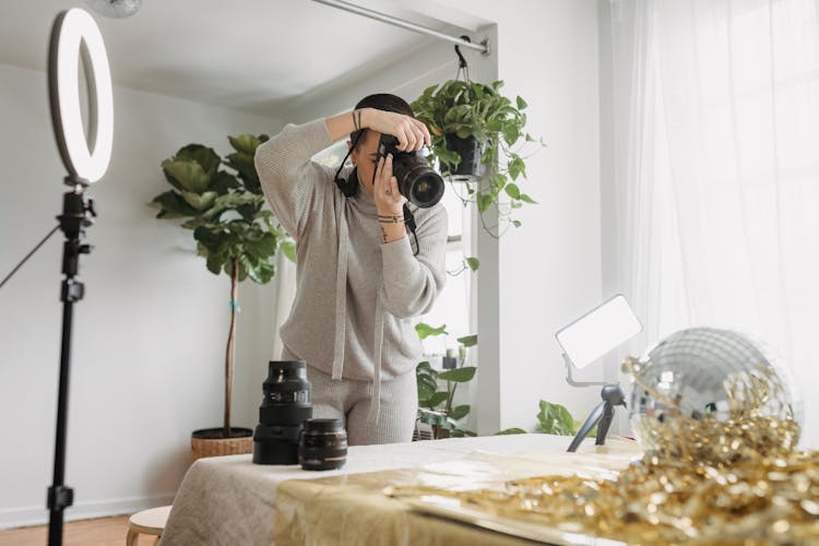 Photographer Shooting Party Ball And Shiny Tinsel