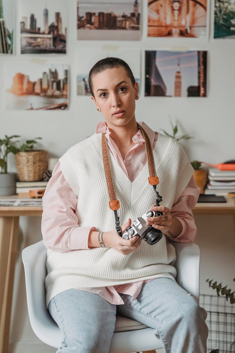 Photographer With Vintage Photo Camera Resting In House Room