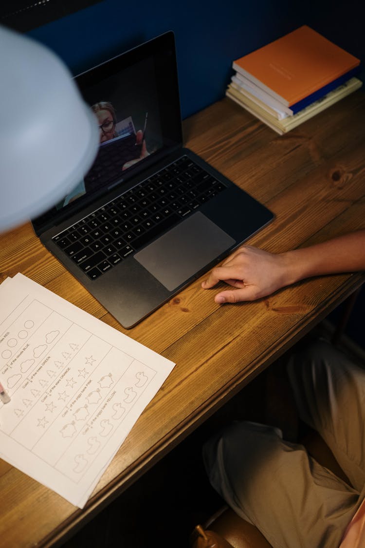 A Student Listening To An Online Class