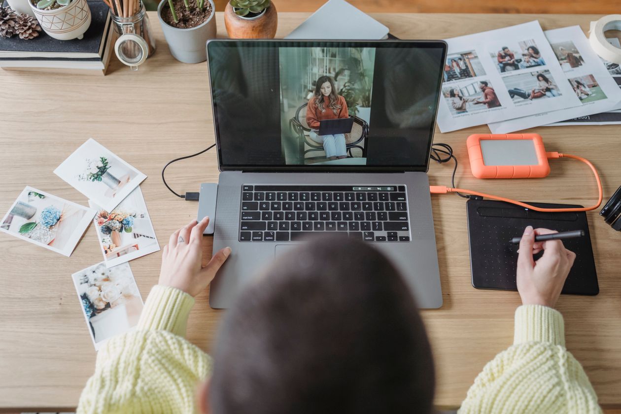 Photographer retouching photos on a laptop