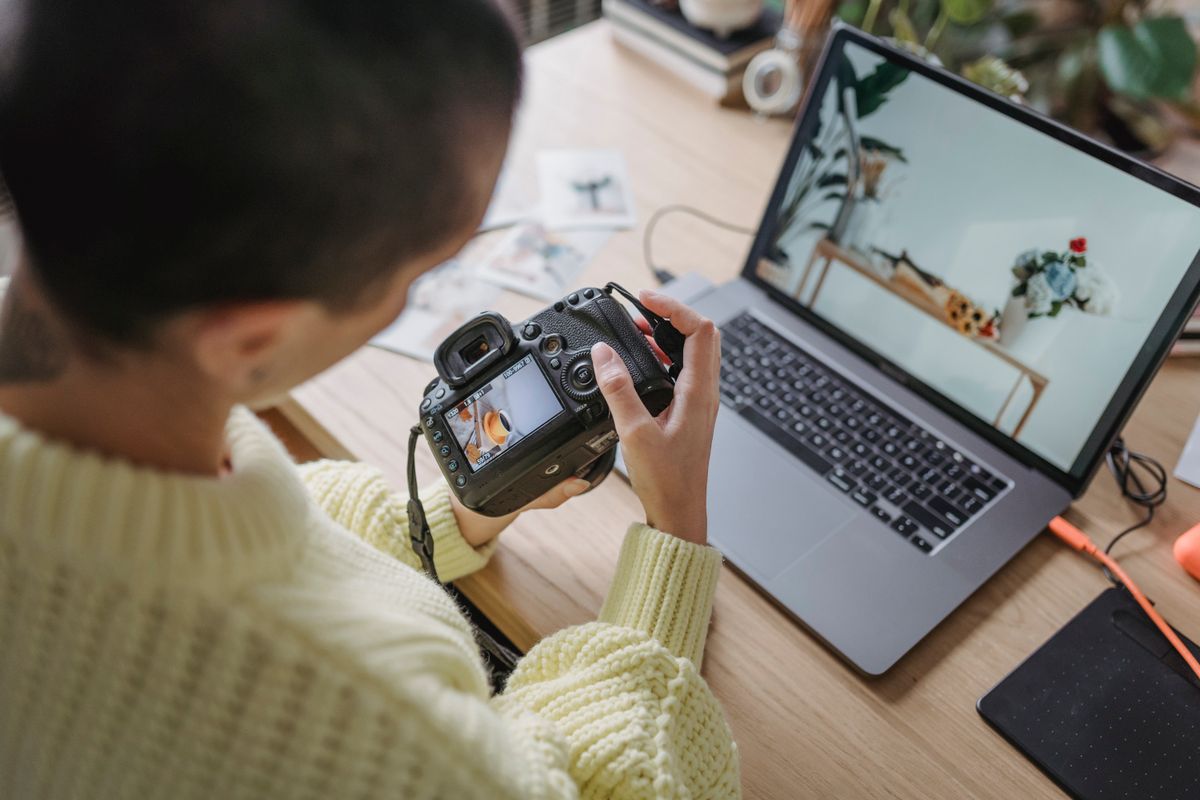 A photographer checking a shot on the camera screen