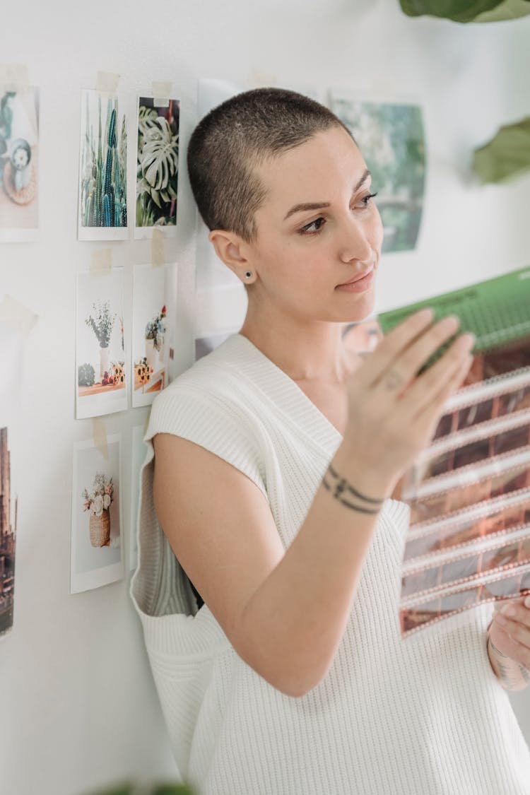 Woman Looking At Photo Films In Light Room