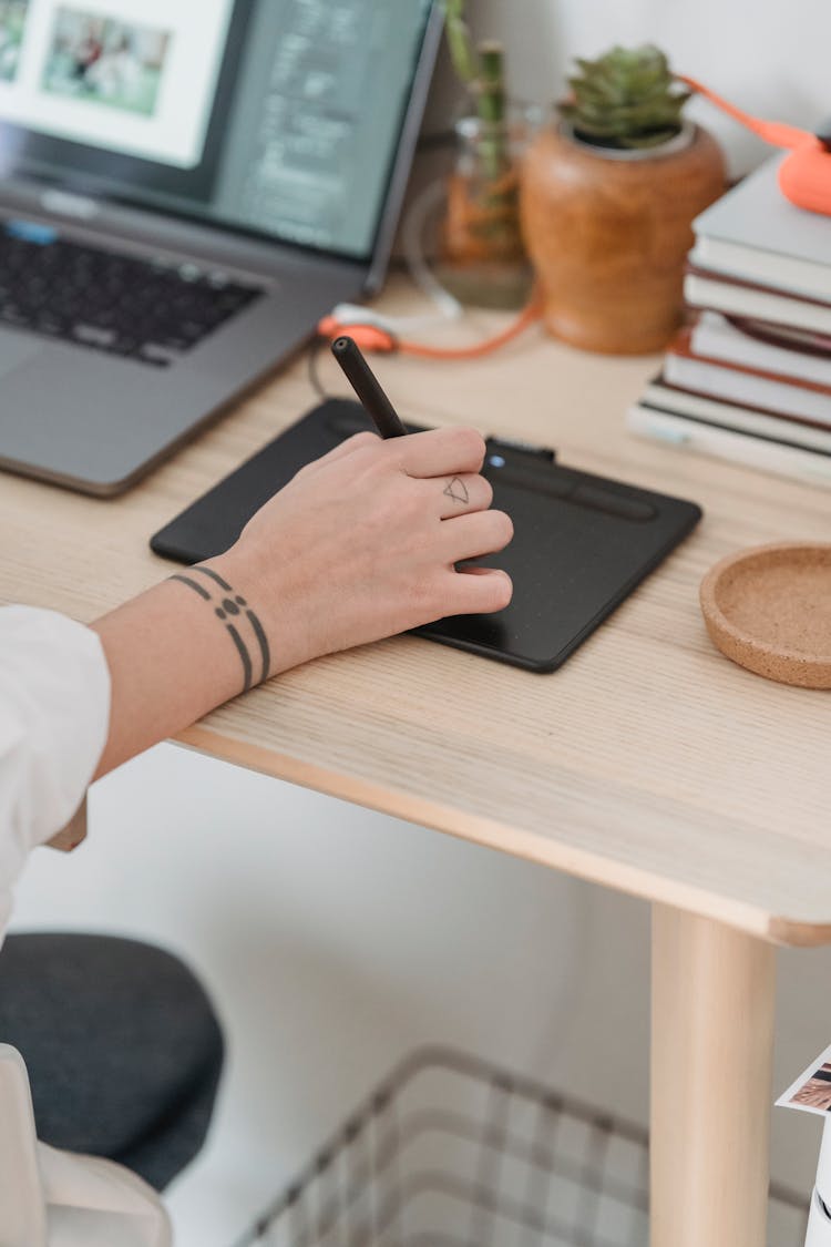 Crop Faceless Woman Working On Laptop And Graphic Tablet