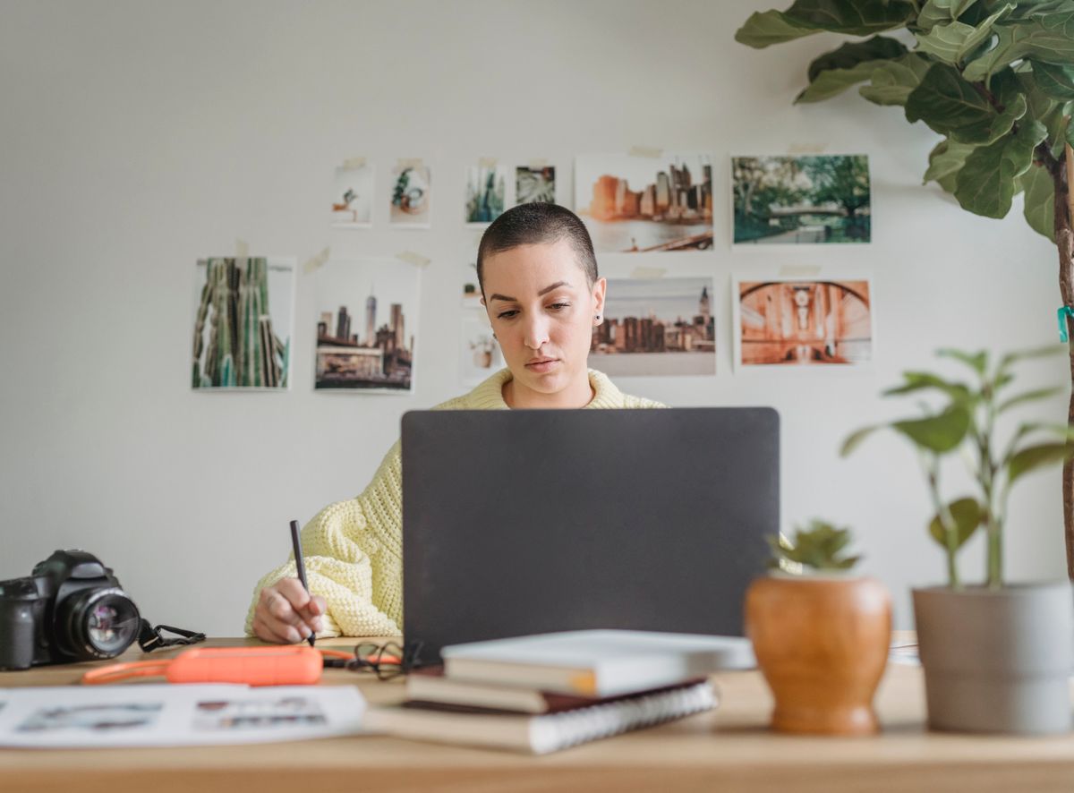 Designer sketching beside a laptop, by George Milton on Pexels