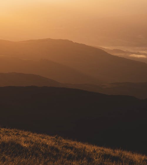 Silhouette of Mountains during Sunset