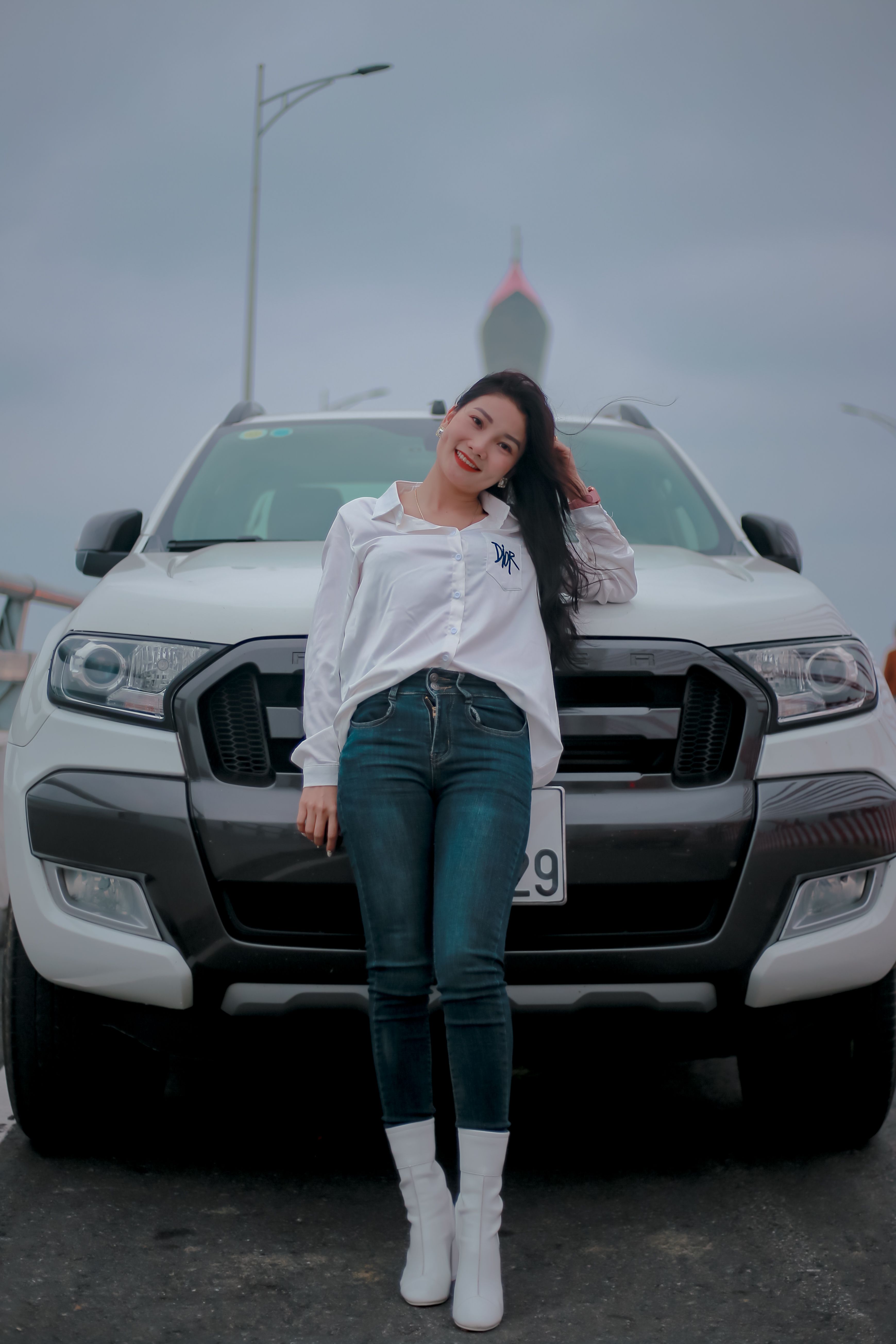 Woman in White Long Sleeves Leaning on White Car · Free Stock Photo