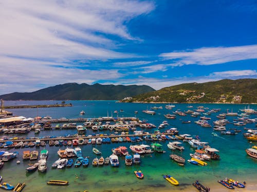 Aerial Photography of Boats on the Ocean Under Blue Sky