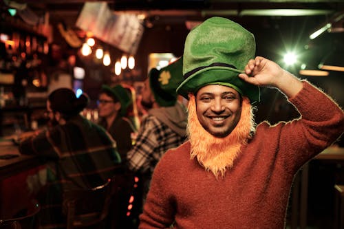 Man in Red Sweater Wearing a Green Hat