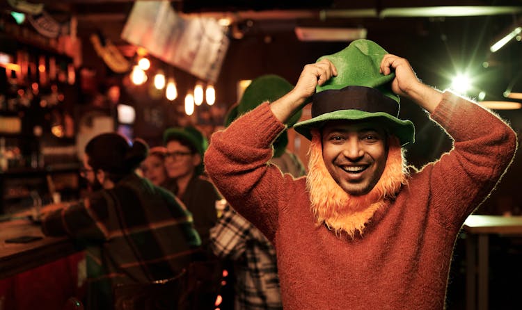 Man In Red Sweater Wearing A Green Hat