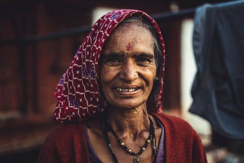 Free Captured moment of an elderly Indian woman smiling warmly, representing cultural heritage. Stock Photo